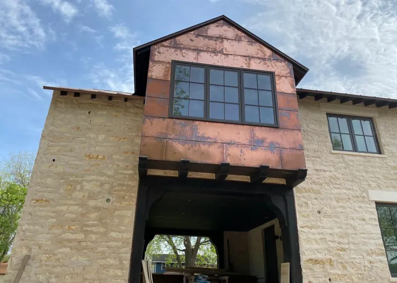 Copper metal panel facade on a stone building for Skylight Installation in Rancho Calaveras