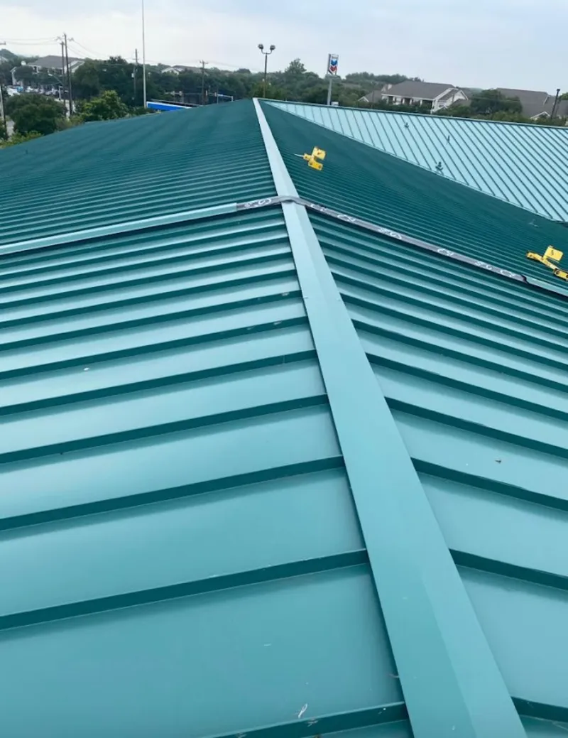 Green commercial metal roof ridge and valley for Metal Roof Repair in Rancho Calaveras